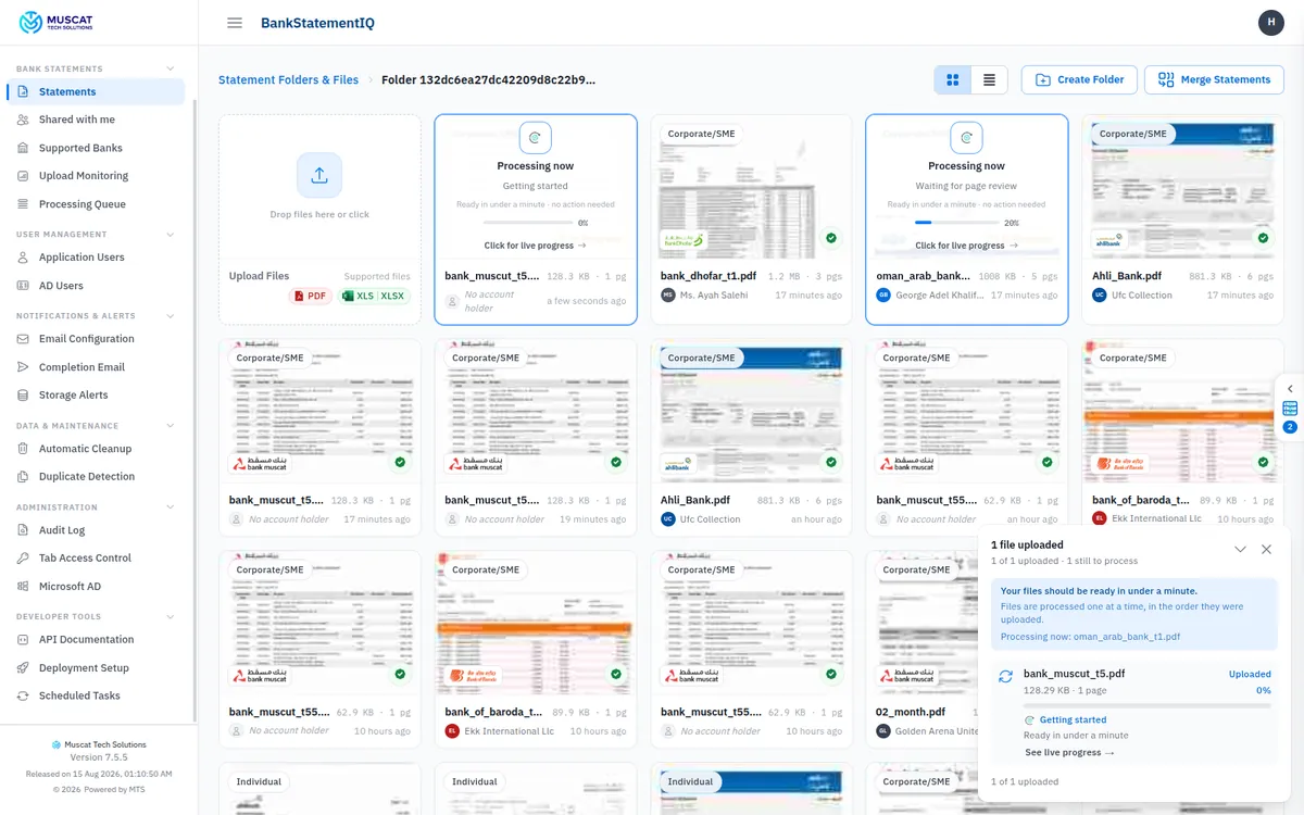Statement folder with files processing live, showing progress cards and an upload status toast